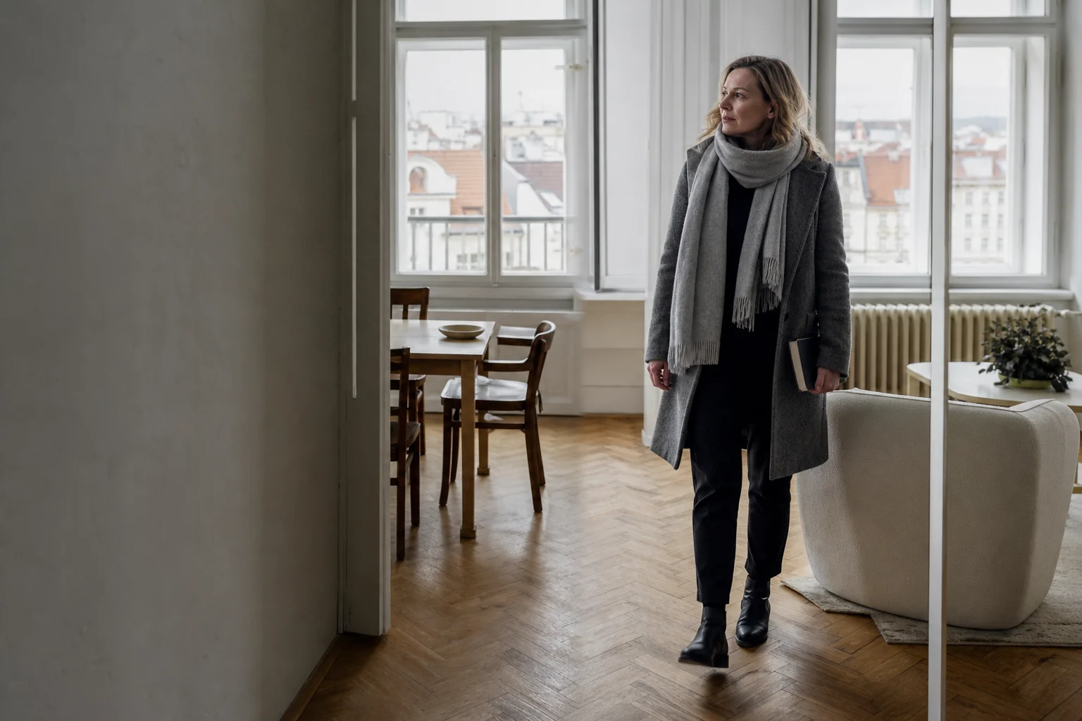 A Prague landlord walking through a guest-ready city apartment
