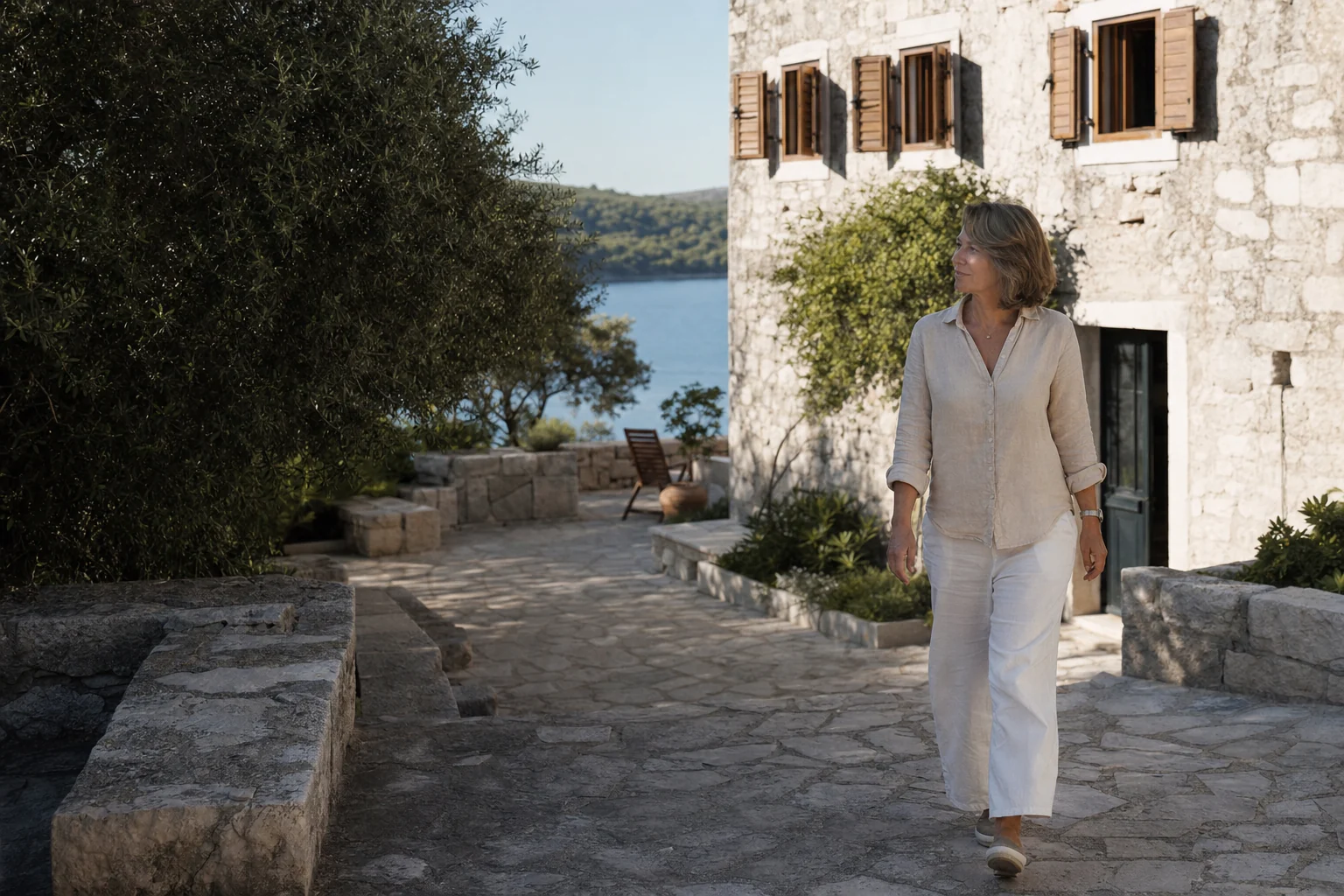A Croatian villa owner arriving at her coastal holiday home